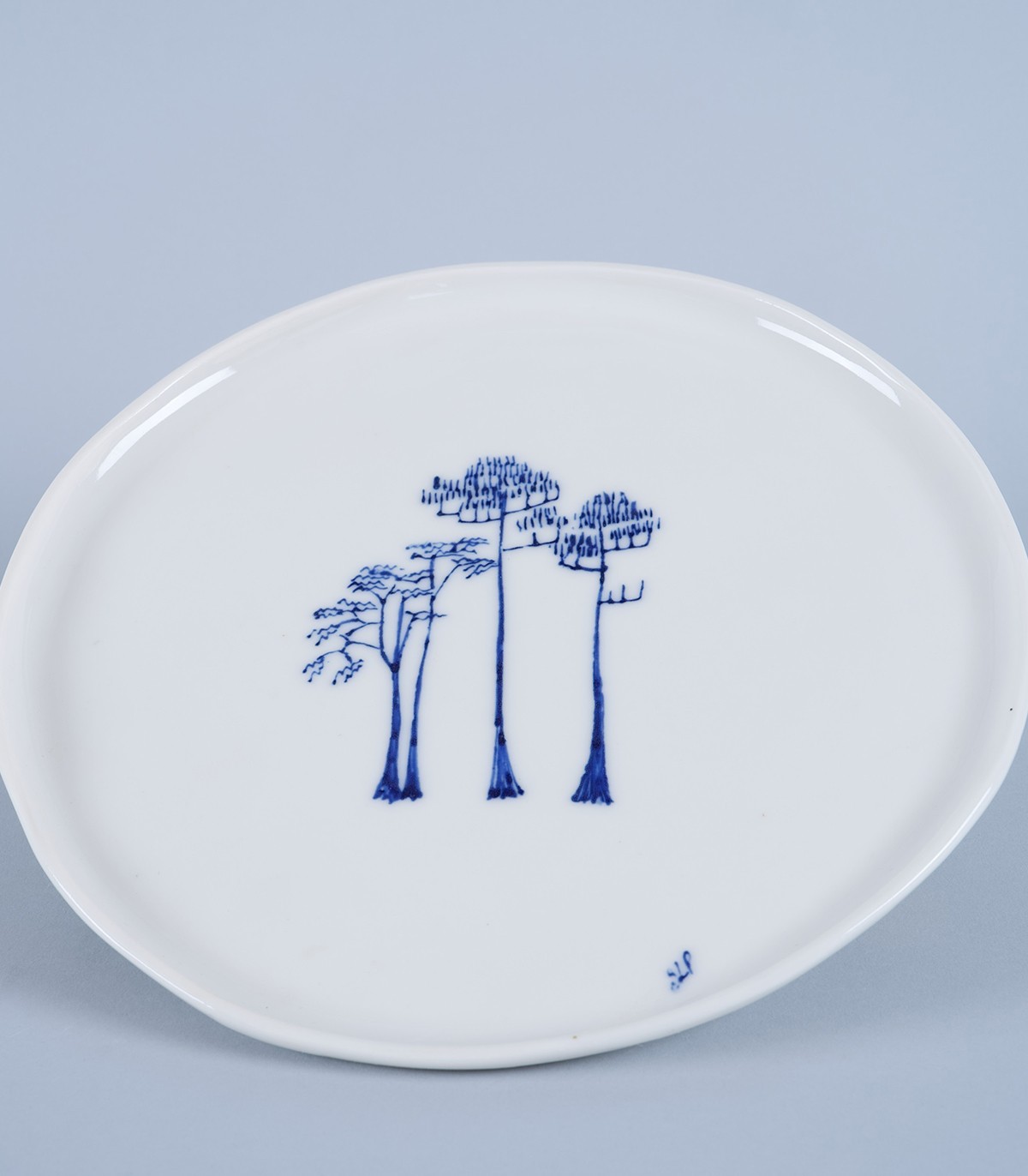 Grand plat de service décor « Pins » en porcelaine